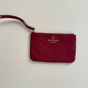 Small maroon Kate Spade wristlet